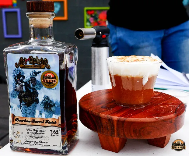 Art of the Spirits Peaks and Pours pick displayed at the 2023 bartender competition