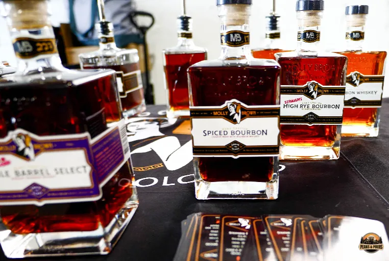 Molly Brown Spiced Bourbon tasting station at Peaks and Pours 2023